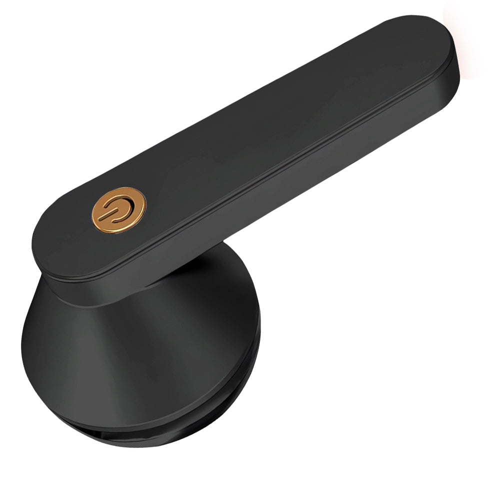 Appareil anti-bouloche noir sur un fond blanc