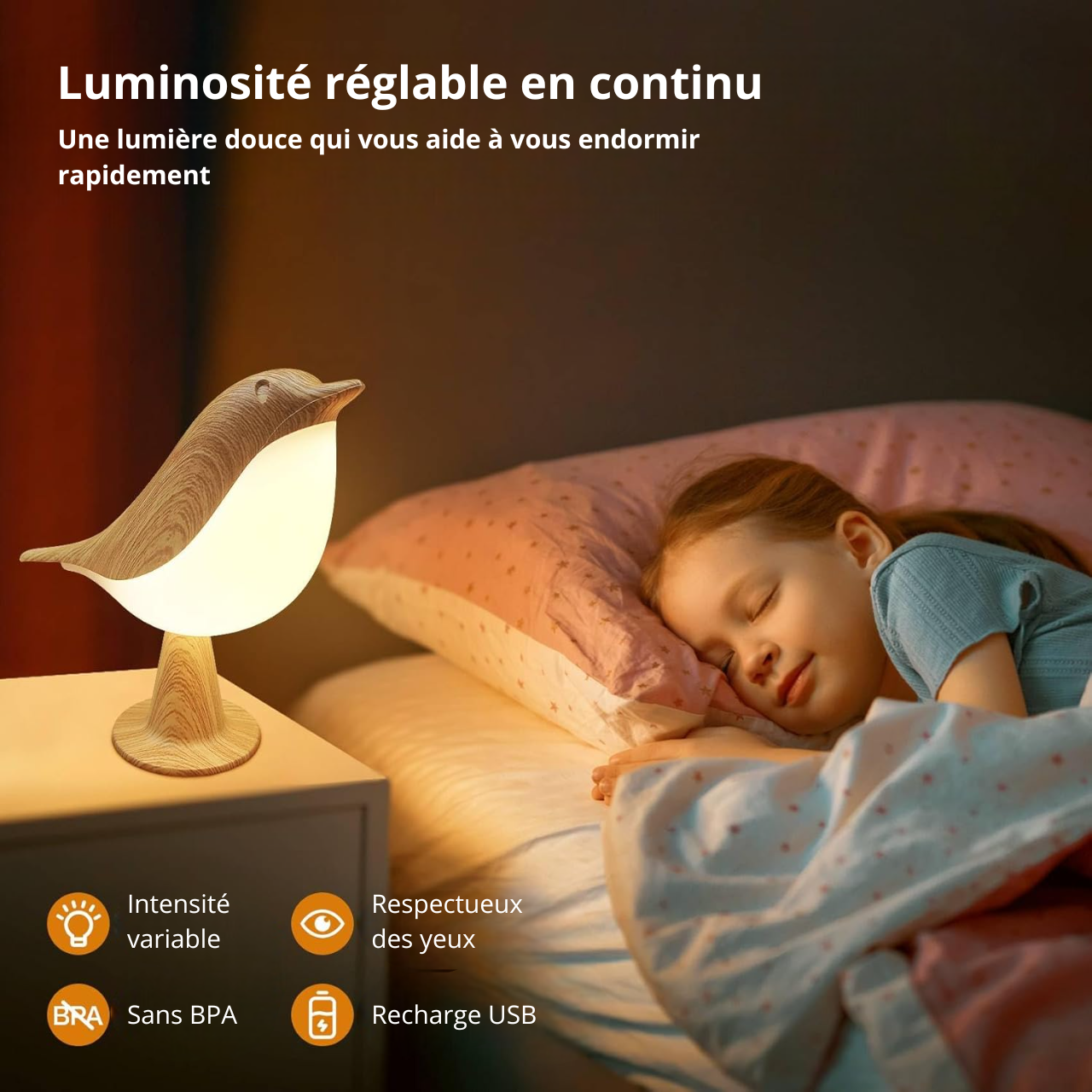 Une petite fille dort paisiblement grâce à sa lampe de chevet tactile en forme d'oiseau