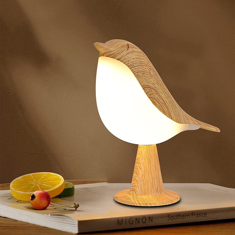 Lampe led tactile en forme d'oiseau allumée diffusant une lumière douce pour une ambiance chaleureuse