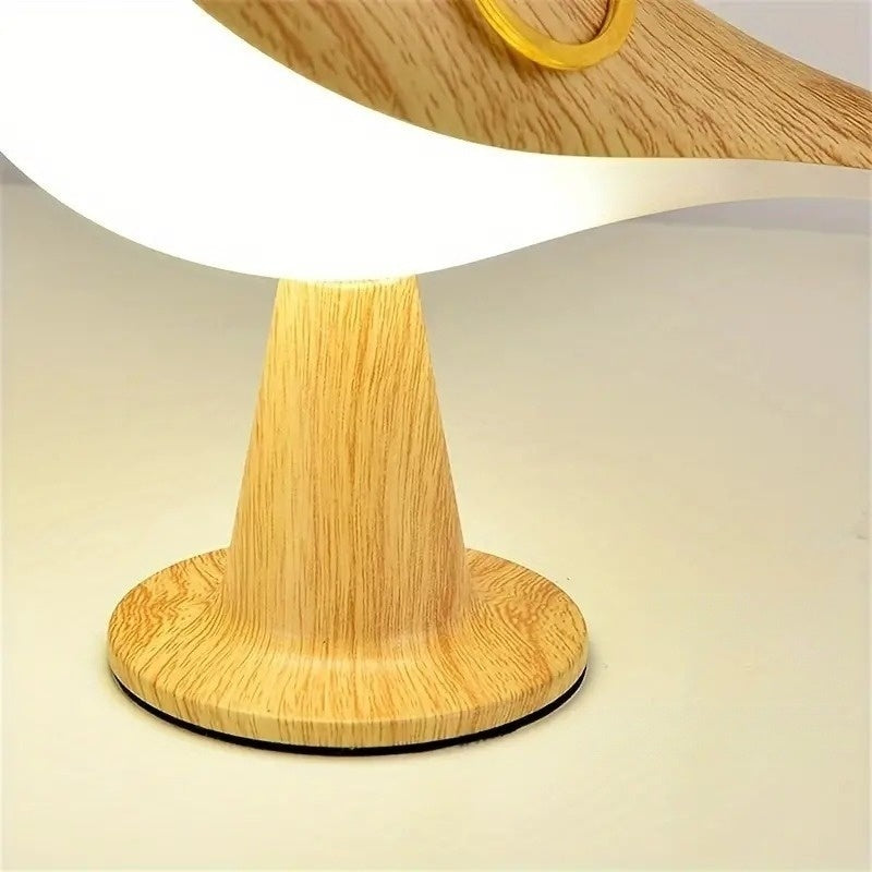 Gros plan sur le socle rond de la lampe led oiseau
