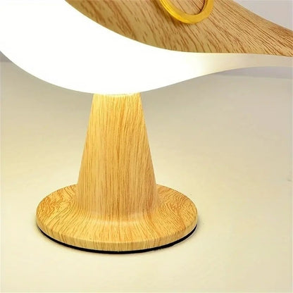 Gros plan sur le socle rond de la lampe led oiseau